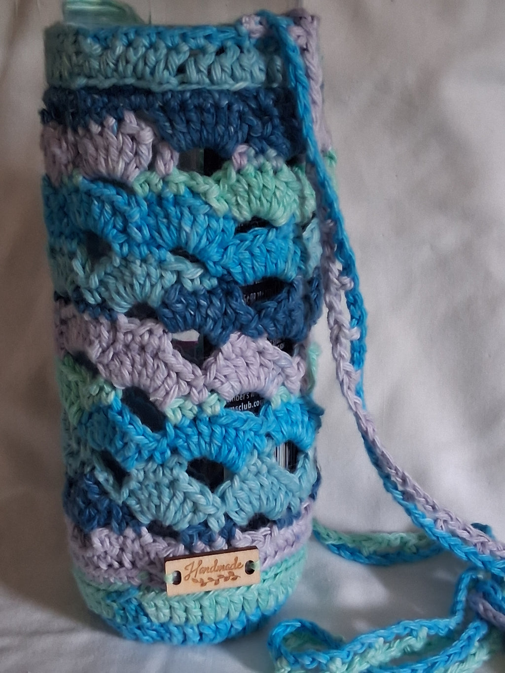 Shell stitch water bottle bag for large and small water bottles large or smaller crossbody bags strap and handmade tag accent